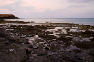 Fototapeta na wymiar View on the sea and rocks on the sunset