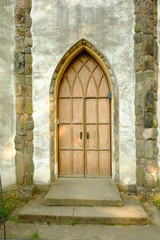 Fototapeta na wymiar Beautiful medieval door - entrance into a church