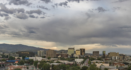 Boise, Idaho. Cityscape with a view from the west at sunset in summertime. Downtown streets and skyscrapers and the Boise Foothills.