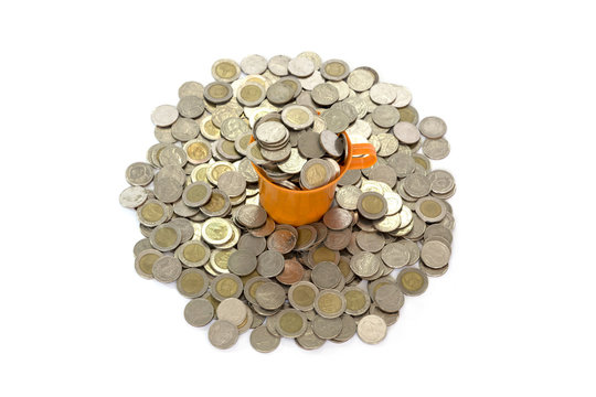 The yellow plastic cup is filled with coins and has a full coin floor isolated from the white background.