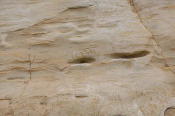 Texture. Sand walls. Holes in wall.