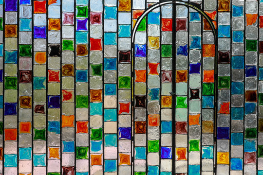 Mosaic Wall of Colorful Stained Glass Squares 