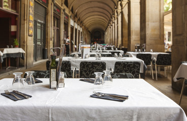 tables in an empty restaurant in anticipation of customers