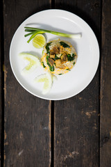 Fried rice with Fried Fish on the wooden table from top view