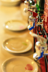 Faucet with glass jar on the table.
