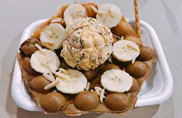 Egg waffle served with chocolate chip ice cream.