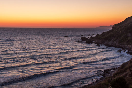 Sunset over Ionian sea at Alonaki bay, Corfu Island, Greece
