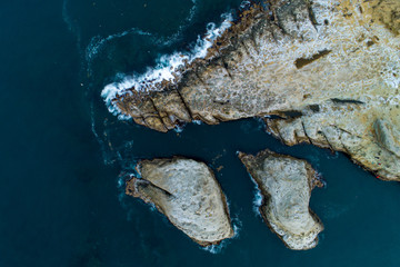 Rock formations at the coastline by the ocean
