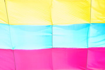 Colorful fabric yellow, blue,pink rainbow color decorated for party. Beautiful background.