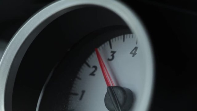 Shaky cam footage of an accelerating speedometer. Shot on Canon C200 in afternoon light in a driving car.