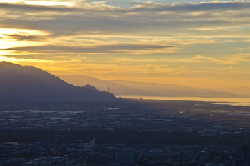 A smog sunset over the salt lake city valley in the evening summer sun. 