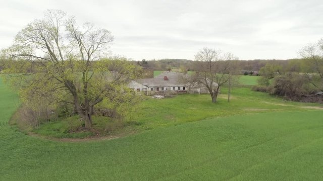 Abandoned Farm Building on Perfect Green Grass Aerial
