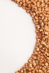Raw buckwheat on white background