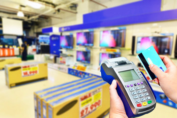 Credit card payment at Television Retail shop.