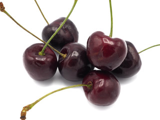 Fresh sweet cherry in shopping cart or trolly isolated on white background.