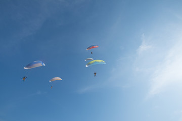 Fototapeta na wymiar The glider pilot team is performing on a blue sky day.