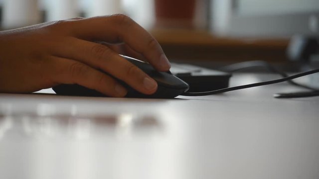 Hand Clicking On A Computer Mouse