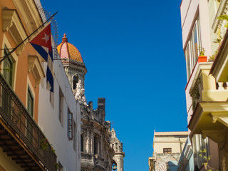 Havana streets with bright colours and cuban flags