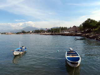 Small boats rest in the waters of Manzanillo, Mexico