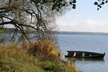 Sights of Belarus. Lake Naroch. Morning on the lake, old boat by the shore.