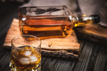Glass and bottle of bourbon whiskey
