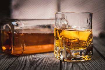 Glass and bottle of bourbon whiskey
