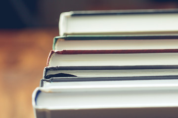 Stack of books on the table. View from above. Selective focus.