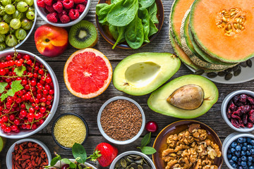 Healthy food on table, fruit assortment, nuts and seeds, superfoods selection