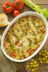vegetable casserole with tomatoes and olives on a bread basis