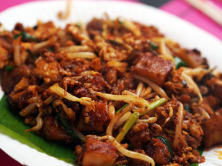 A plate of famous Malaysia Delicacy, black soy sauce Fried Koay Teow on a place ready to be served