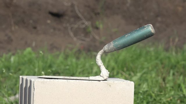 mason's trowel on masonry