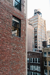 Fototapeta premium Cityscape of New York with old buildings and water towers