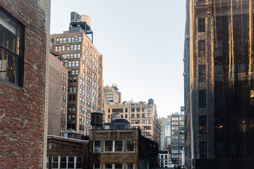 Fototapeta premium Cityscape of New York with old buildings and water towers