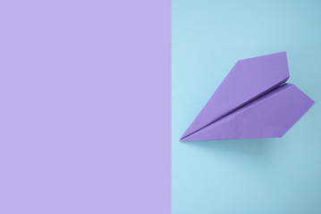 Paper plane on colorful background.