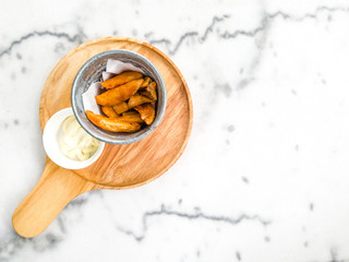 Top view of wooden tray on marble table background