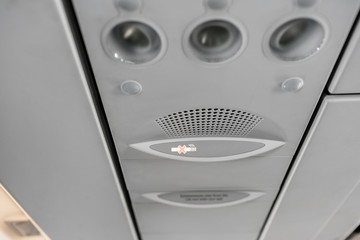 Air condition unit and lighting of aerospace on the ceiling of passenger cabin. Modern Airplane...
