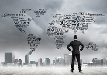 Motivation and inspiration concept with modern cityscape and businessman observing it