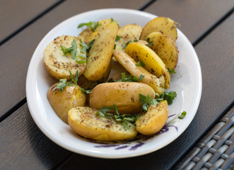  potatoes with herbs sprinkled with green parsley