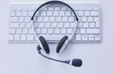 Communication support, call center and customer service help desk. VOIP headset on laptop computer...