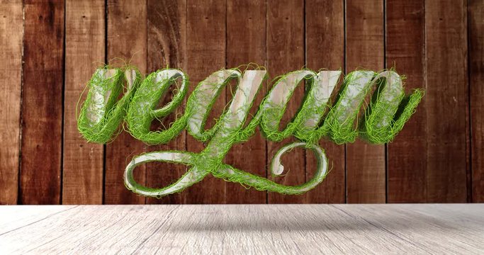 Das Wort &bdquo;vegan&ldquo; in Holzoptik. Zweige wachsen daran, w&auml;hrend die Kamera auf die Buchstaben zuf&auml;hrt. 