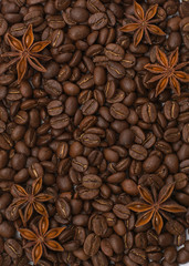 Background of coffee beans. Coffee texture. Cinnamon sticks and cardamom.
