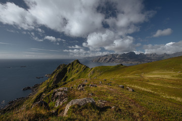 Blue sea shore with view to mountains in the Norway at summer time
