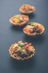 Crispy Canape or canapé is a starter recipe from India - Round or square shaped Puri Filled with...