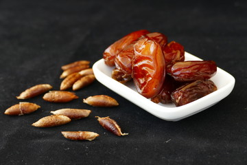 dates and dates kernel on a black background,
