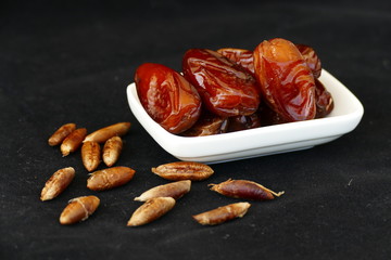 dates and dates kernel on a black background,
