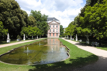 Obraz premium Street photography. Electoral Palace in Trier, Germany. The Electoral Palace directly next to the Basilika is considere done oft hemost beautiful rococo palaces in the world.