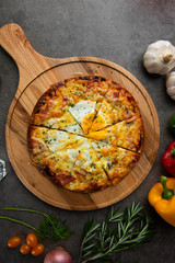 Pizza with egg ham and mushrooms