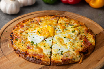 Pizza with egg ham and mushrooms