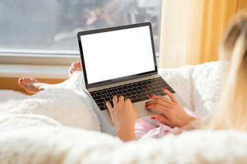 Woman working with laptop at home