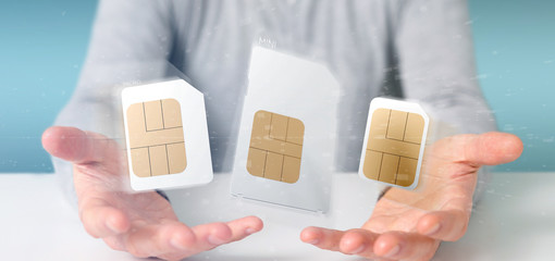 Businessman holding Different size of a smartphone sim card 3d rendering